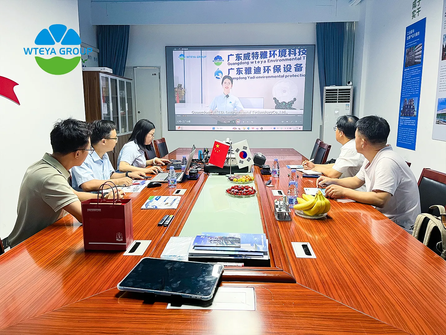 WTEYA engineers explaining reverse osmosis system technology to Korean visitors